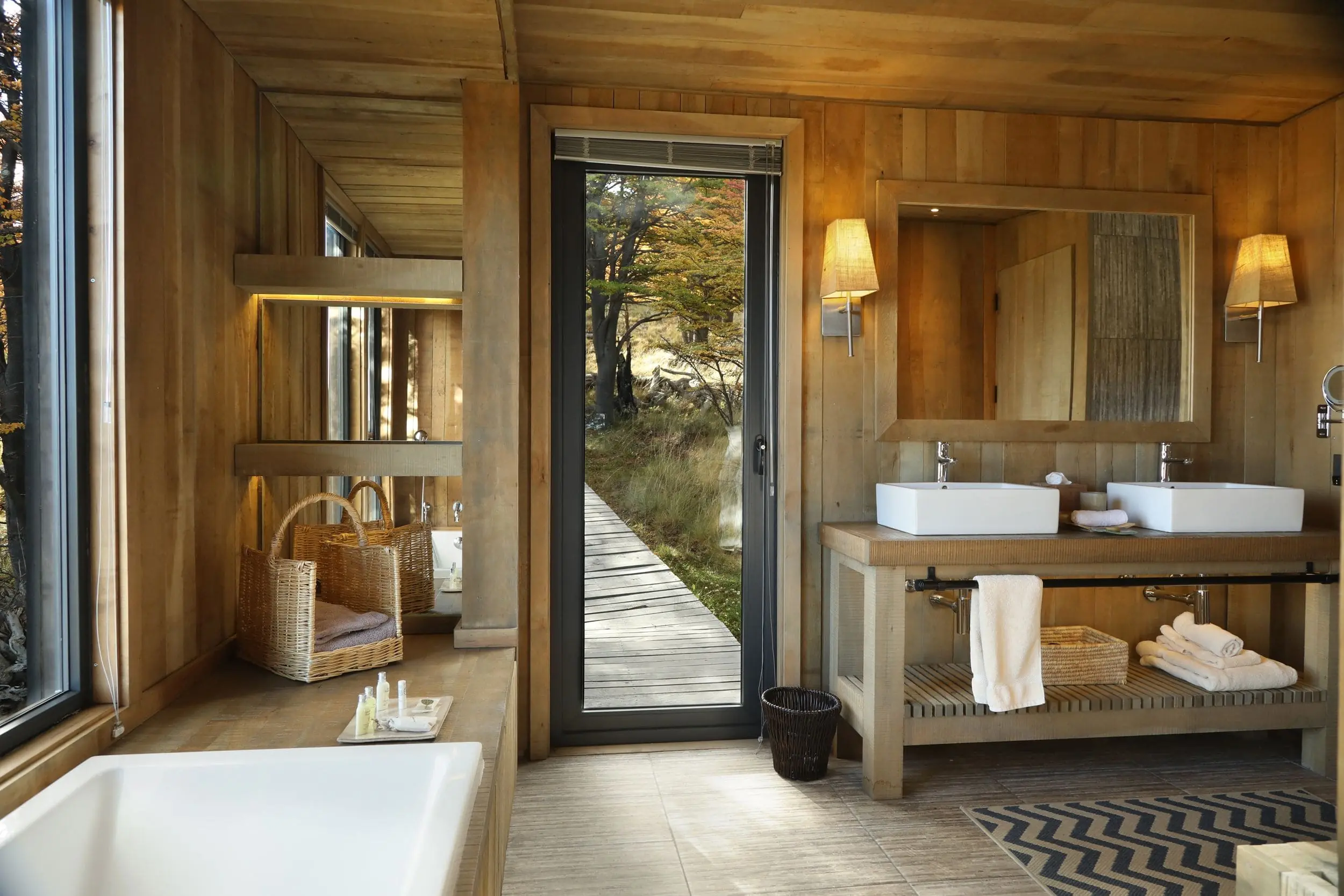 &Quot;Luxury Bathroom In A Private Villa At Awasi Patagonia In Torres Del Paine National Park, Chile, Featuring A Deep Soaking Bathtub, Separate Shower, Double Sinks, And A Large Mirror. The Villa Is Crafted From Native Wood With Decor Inspired By Patagonian Shelters, Offering Privacy And Views Of The Forest, Lake, And Surrounding National Park.